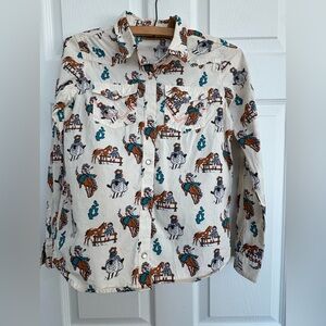 Like new girls size large WRANGLER rodeo long sleeve pearl snap shirt.
